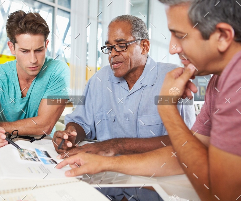demo-attachment-121-group-of-men-meeting-in-creative-office-PXEKFW4